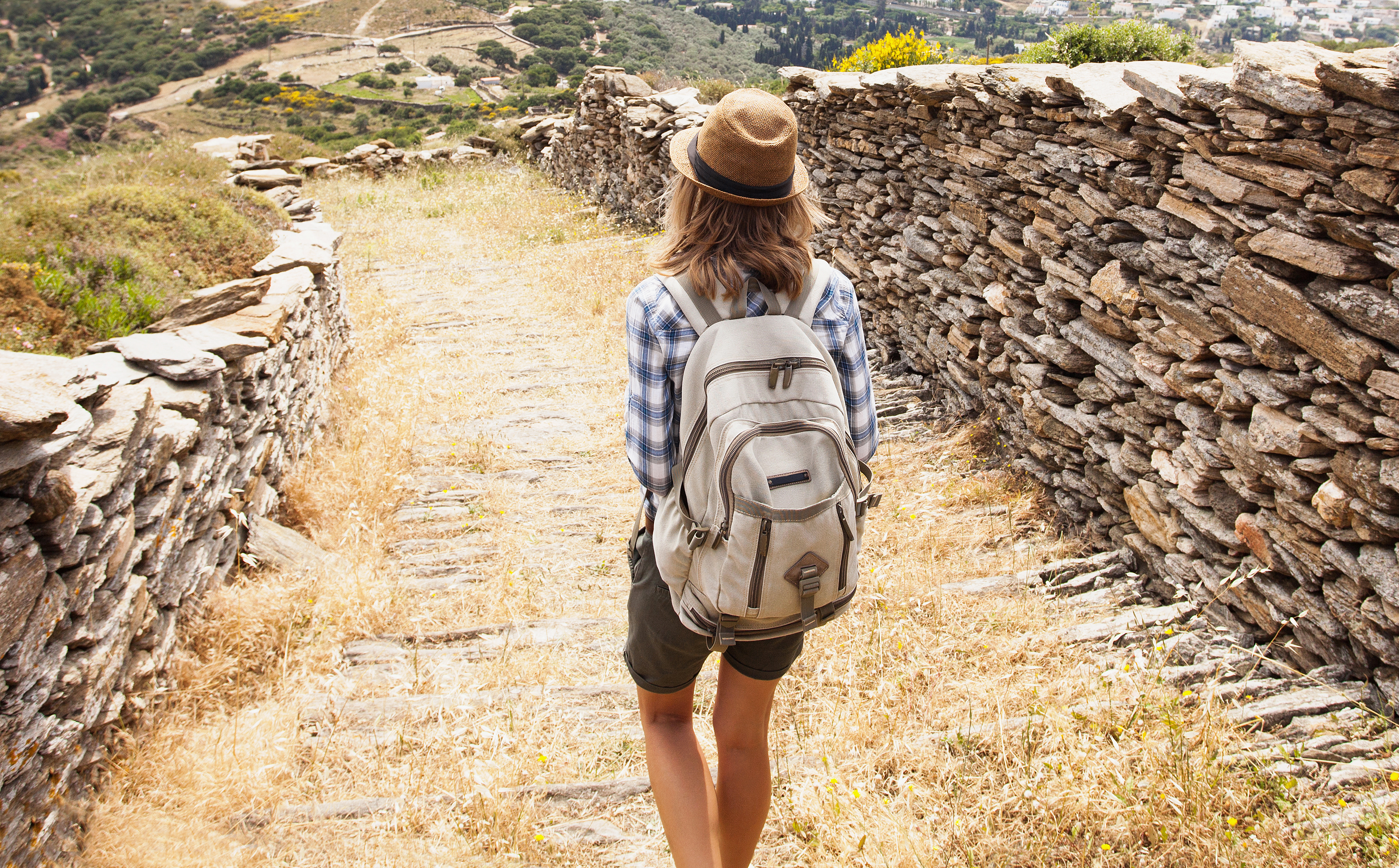 Young girl hiker on mountain trail
